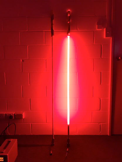 LED whip illuminated in the dark, showcasing its bright and colorful lighted design to improve visibility and safety for vehicles in low-light conditions.